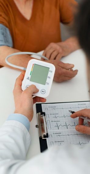 older-person-checking-their-blood-pressure-with-tensiometer